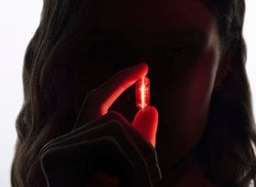 2026 luxe division woman holding red led longevity visual