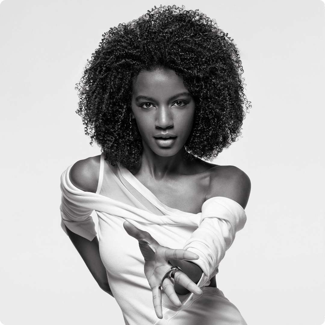 2025 kerastase loreal professional product woman with curly hair in white dress