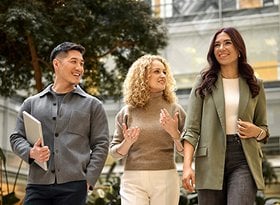 2026 Careers Website Card Two women a man walking in Loreal Campus with laptops