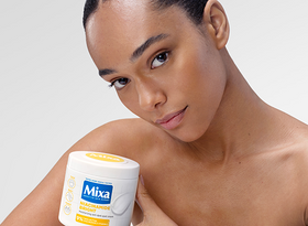 2026 consumer product division brands woman holding mixa niacinamide bright cream
