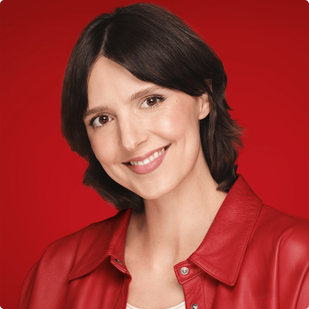 2025 vichy luxe brand woman in bob cut red leather jacket smiling